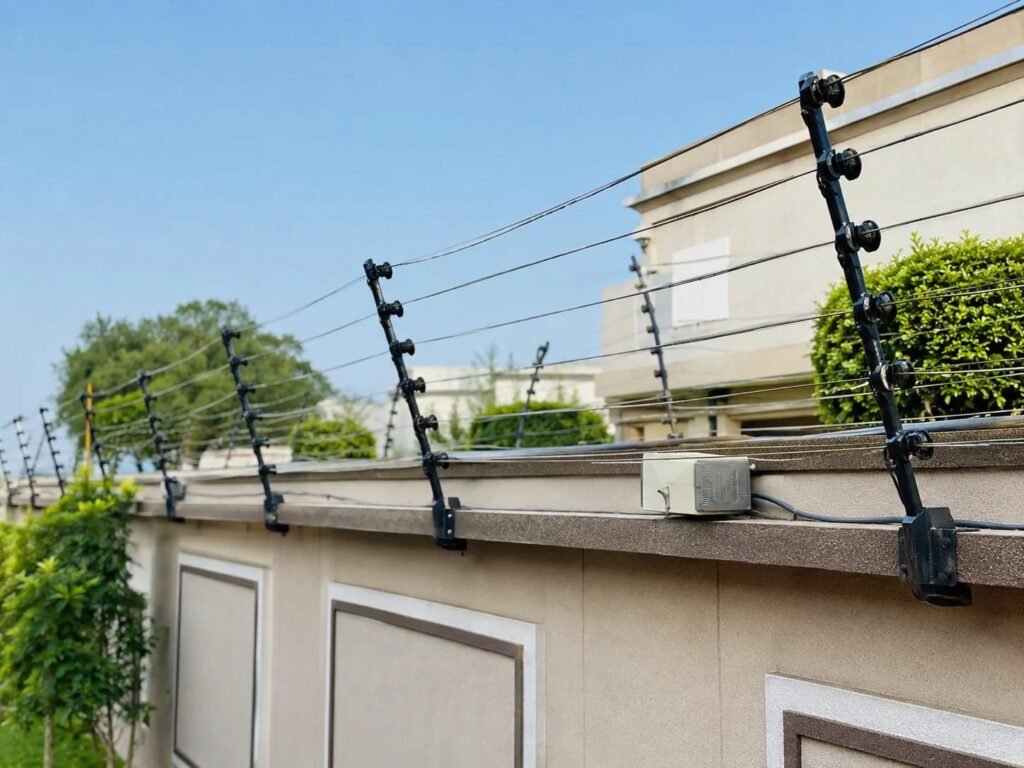Shelly Technologies electric fencing along a residential boundary wall